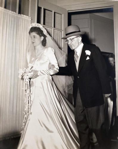 Lois escorted by her father, Dr. Louis Drosin